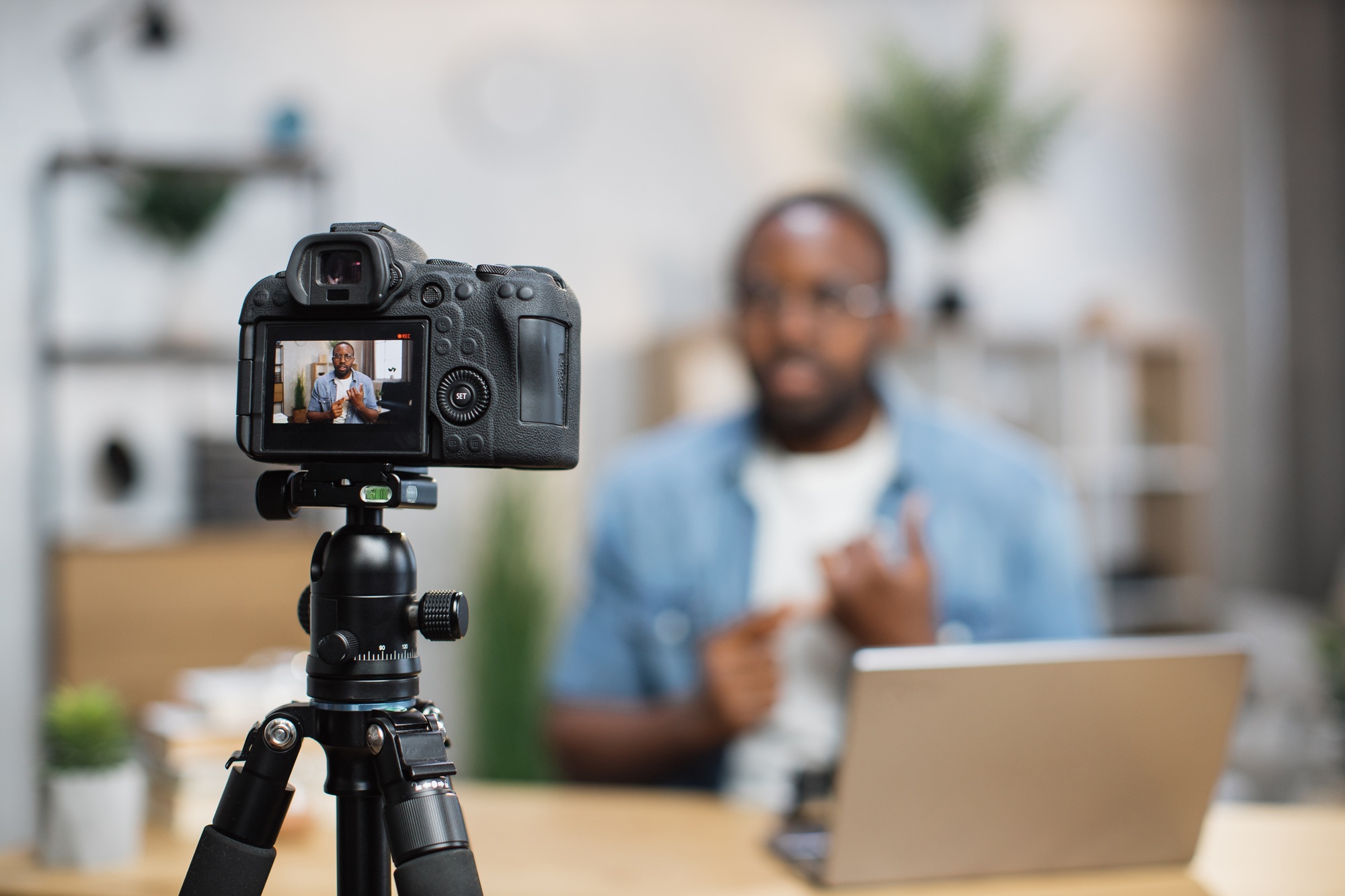 African guy recording new video blog on digital camera African guy recording new video blog on digital camera