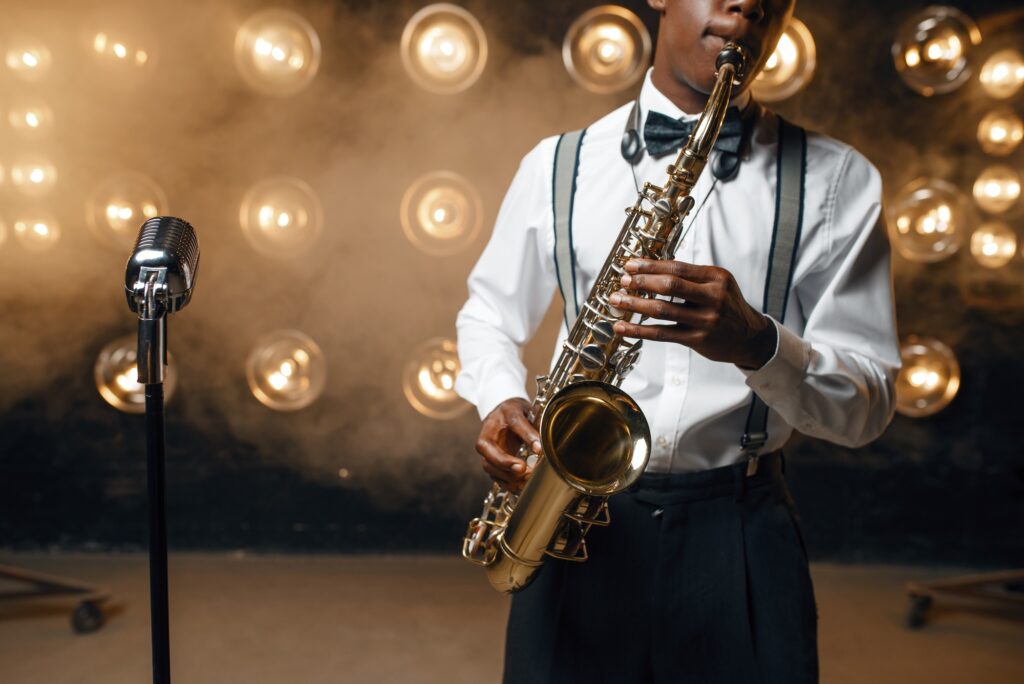 Black jazz performer plays the saxophone on stage