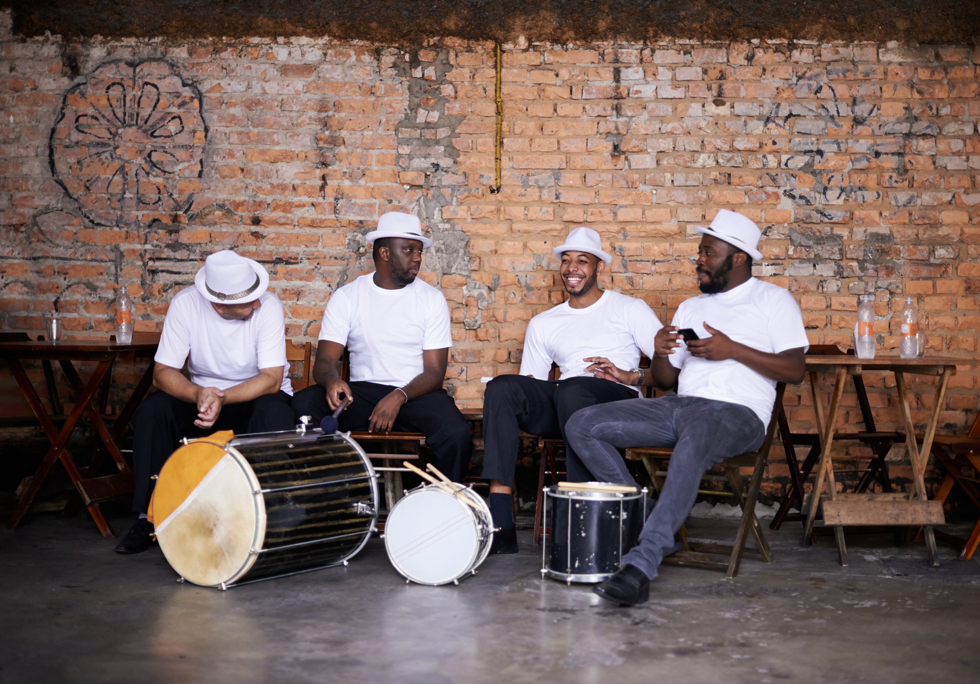 Shot of a band playing their percussion instruments in a Brazilian setting Shot of a band playing their percussion instruments in a Brazilian setting